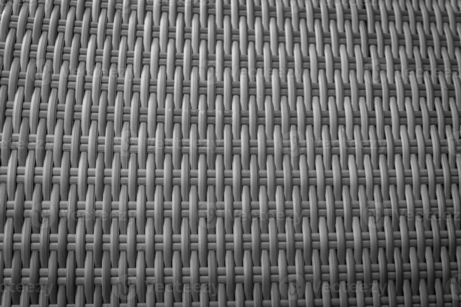 Synthetic rattan texture weaving background as used on outdoor photo