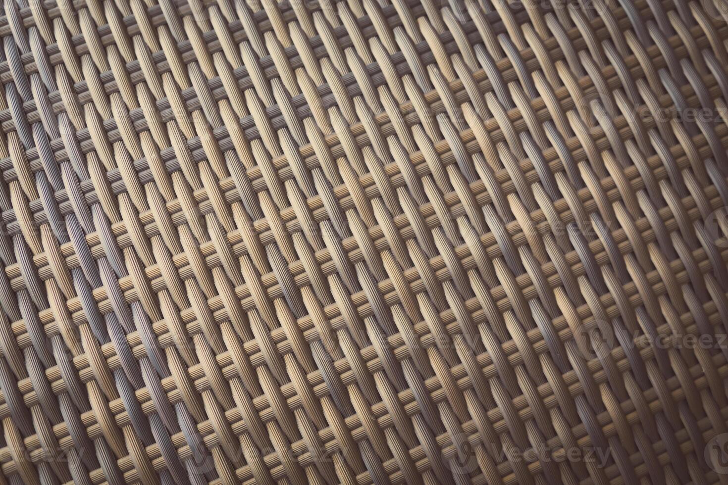 Synthetic rattan texture weaving background as used on outdoor garden furniture. photo