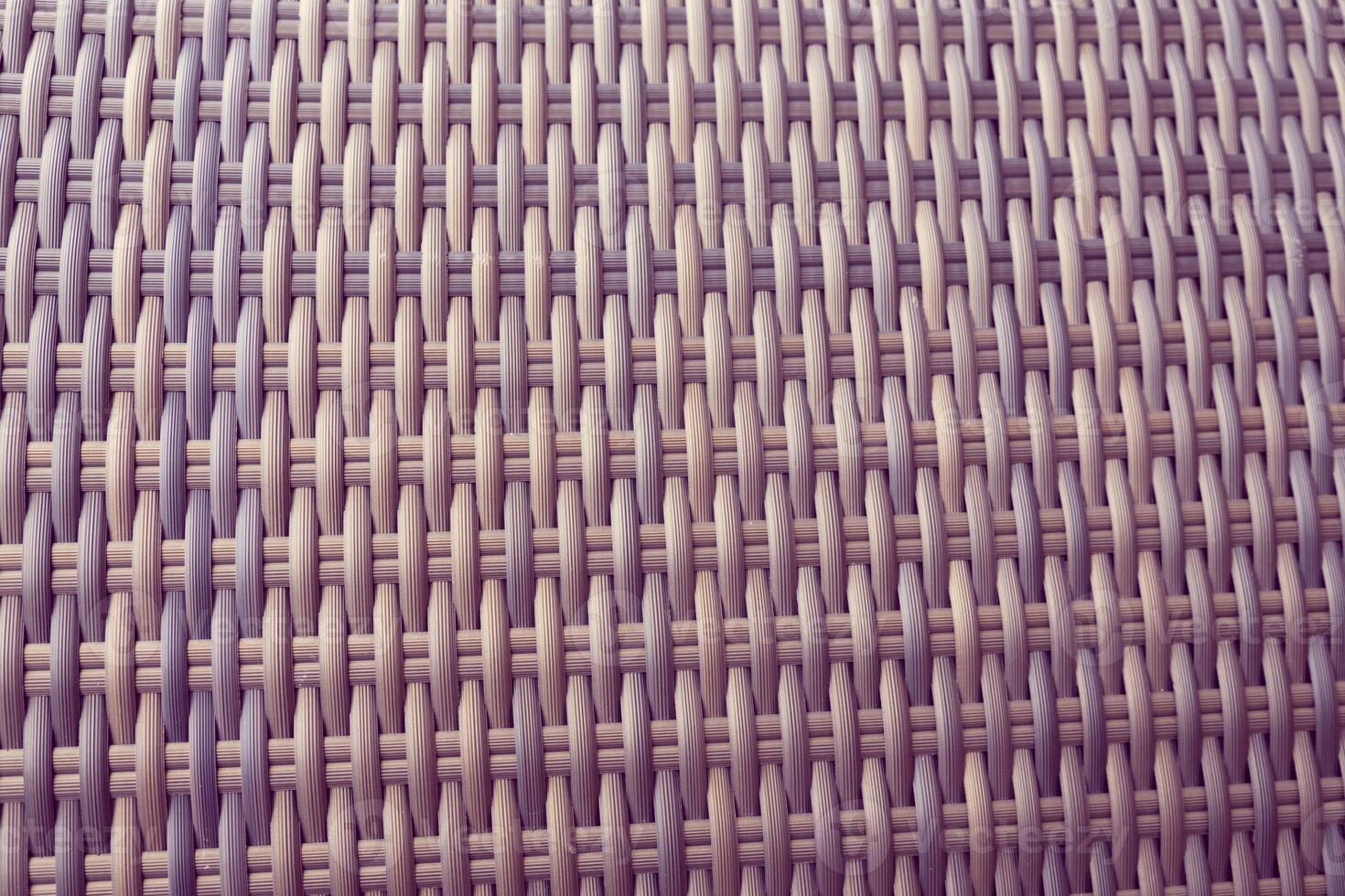 Synthetic rattan texture weaving background as used on outdoor garden furniture. photo