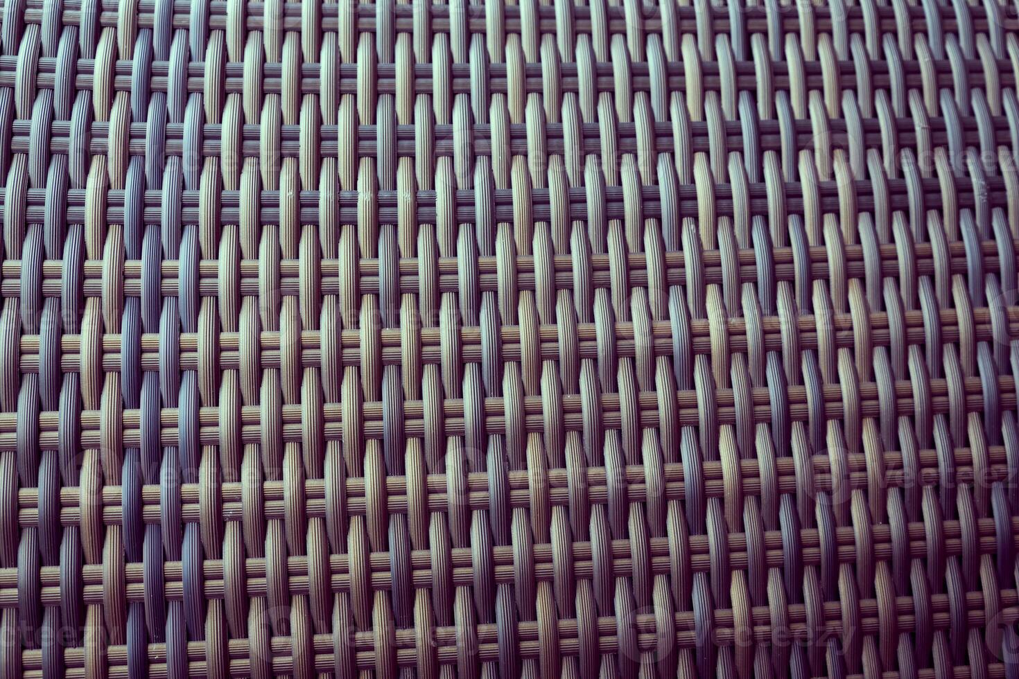 Synthetic rattan texture weaving background as used on outdoor garden furniture. photo
