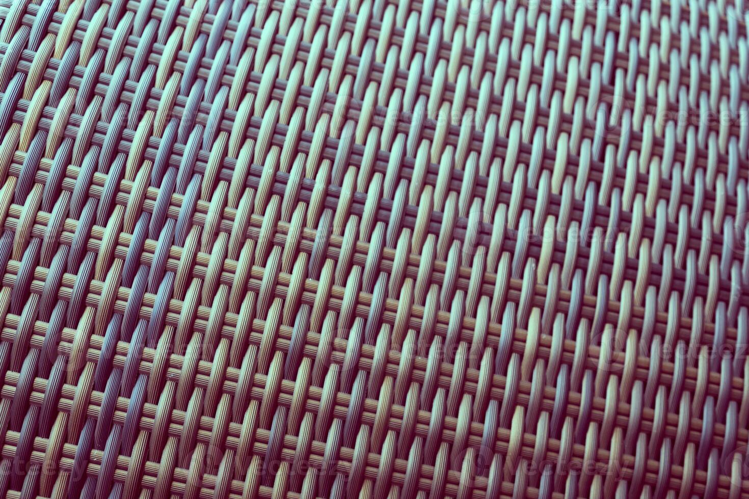 Synthetic rattan texture weaving background as used on outdoor garden furniture. photo