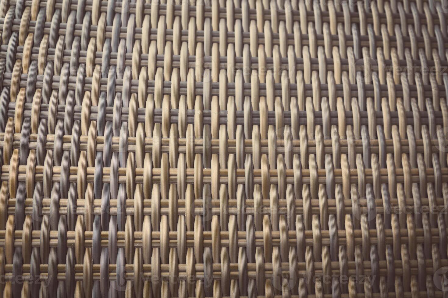 Synthetic rattan texture weaving background as used on outdoor garden furniture. photo