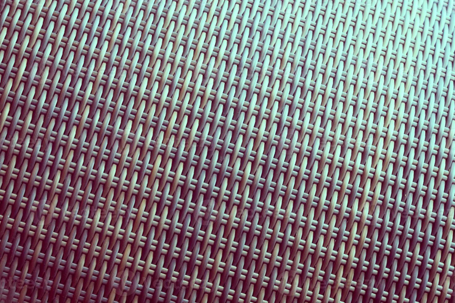 Synthetic rattan texture weaving background as used on outdoor garden furniture. photo