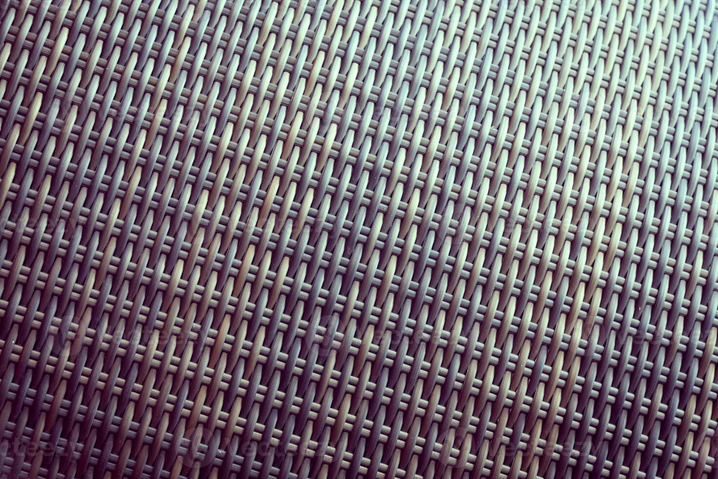 Synthetic rattan texture weaving background as used on outdoor garden furniture. photo