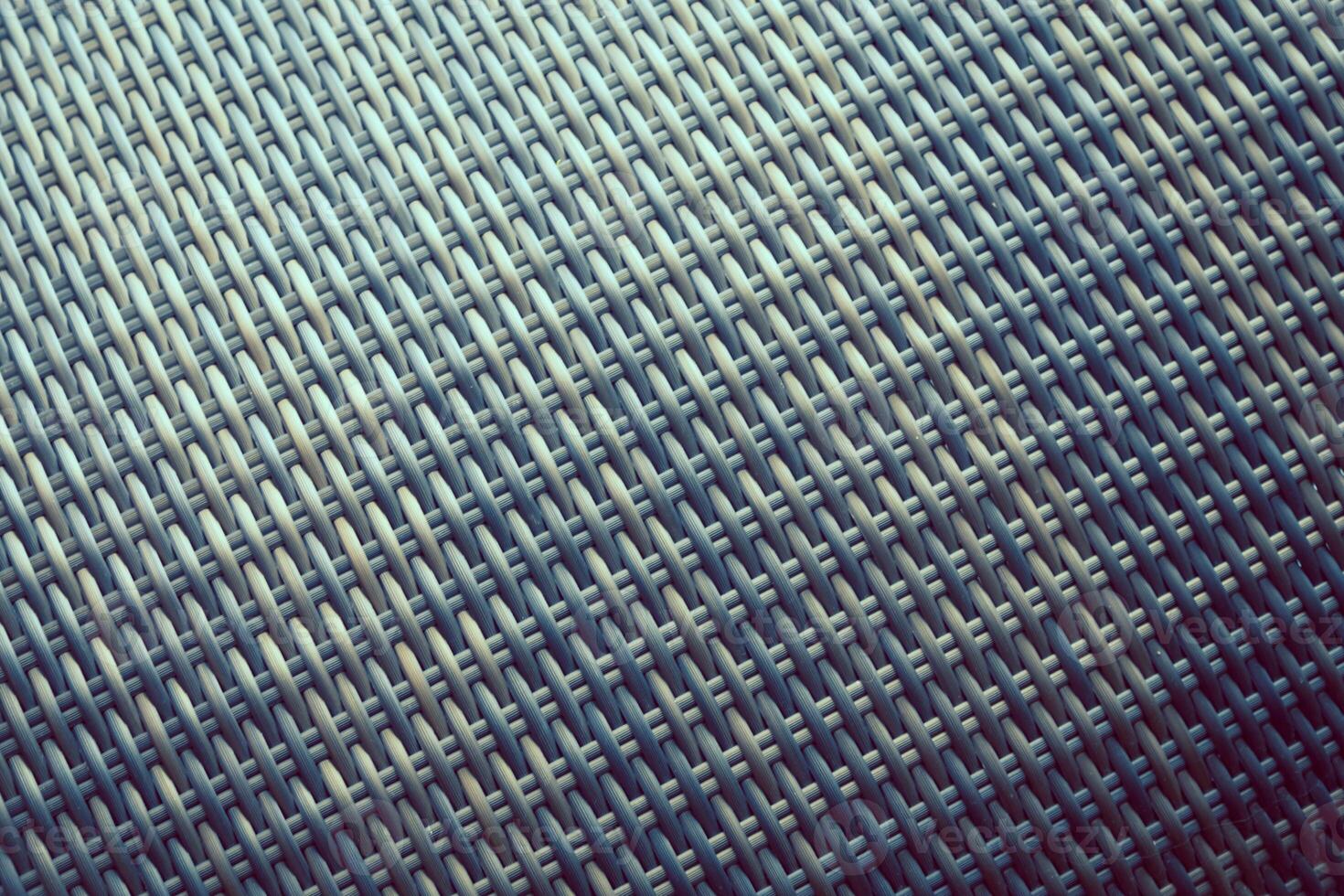 Synthetic rattan texture weaving background as used on outdoor garden furniture. photo