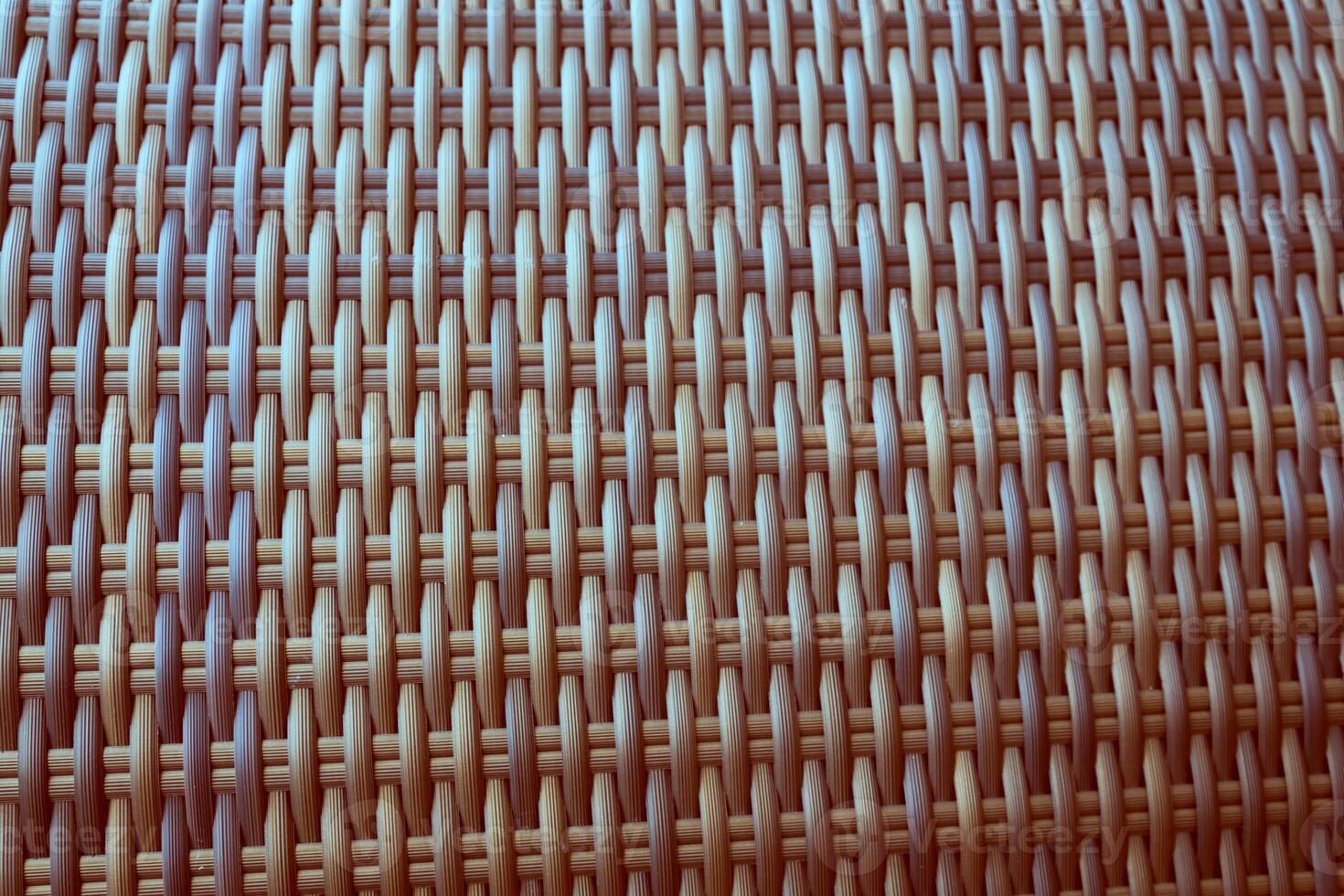 Synthetic rattan texture weaving background as used on outdoor garden furniture. photo