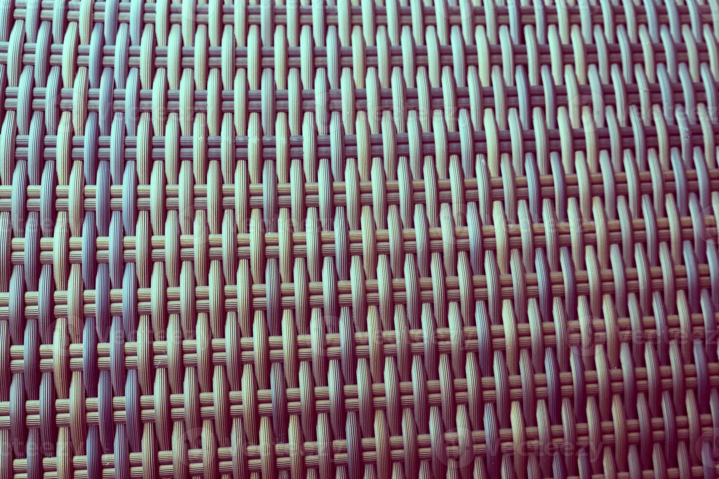 Synthetic rattan texture weaving background as used on outdoor garden furniture. photo