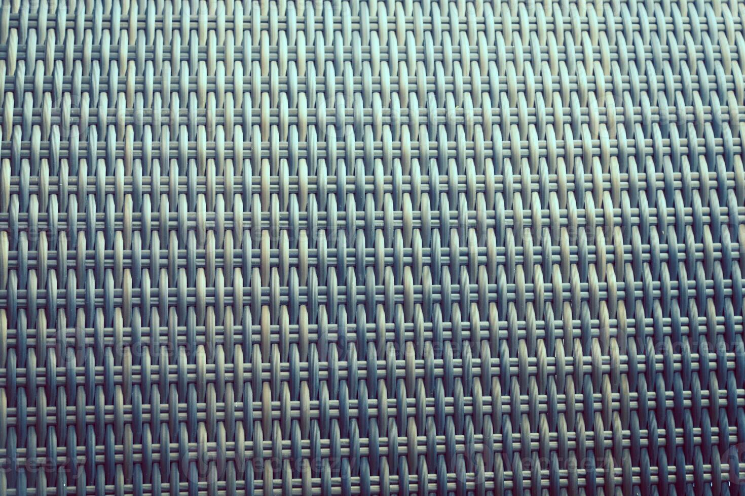 Synthetic rattan texture weaving background as used on outdoor garden furniture. photo