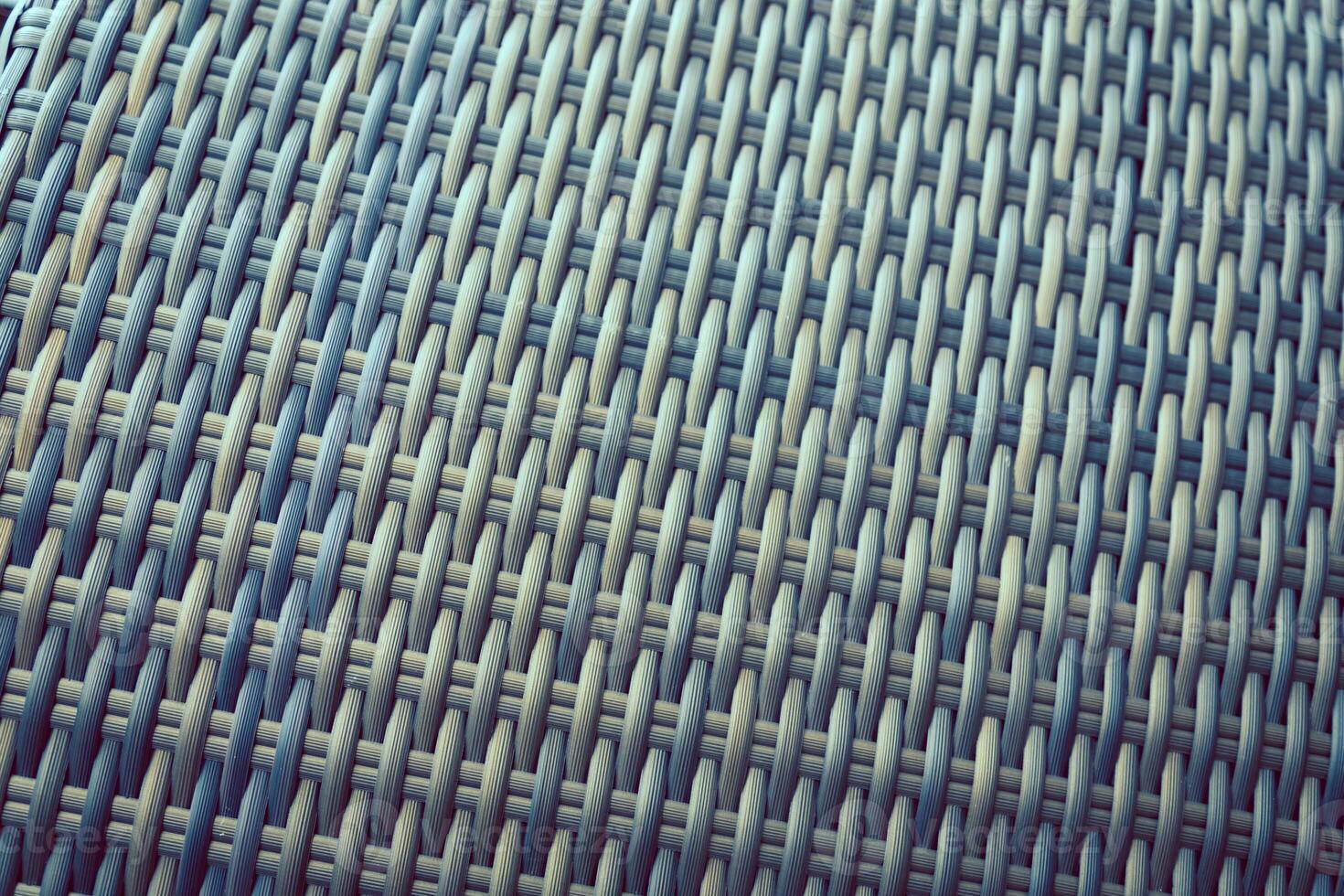 Synthetic rattan texture weaving background as used on outdoor garden furniture. photo