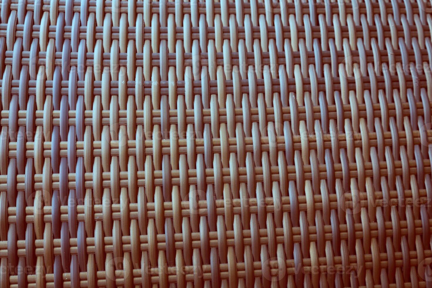 Synthetic rattan texture weaving background as used on outdoor garden furniture. photo