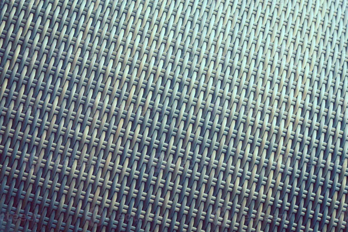 Synthetic rattan texture weaving background as used on outdoor garden furniture. photo