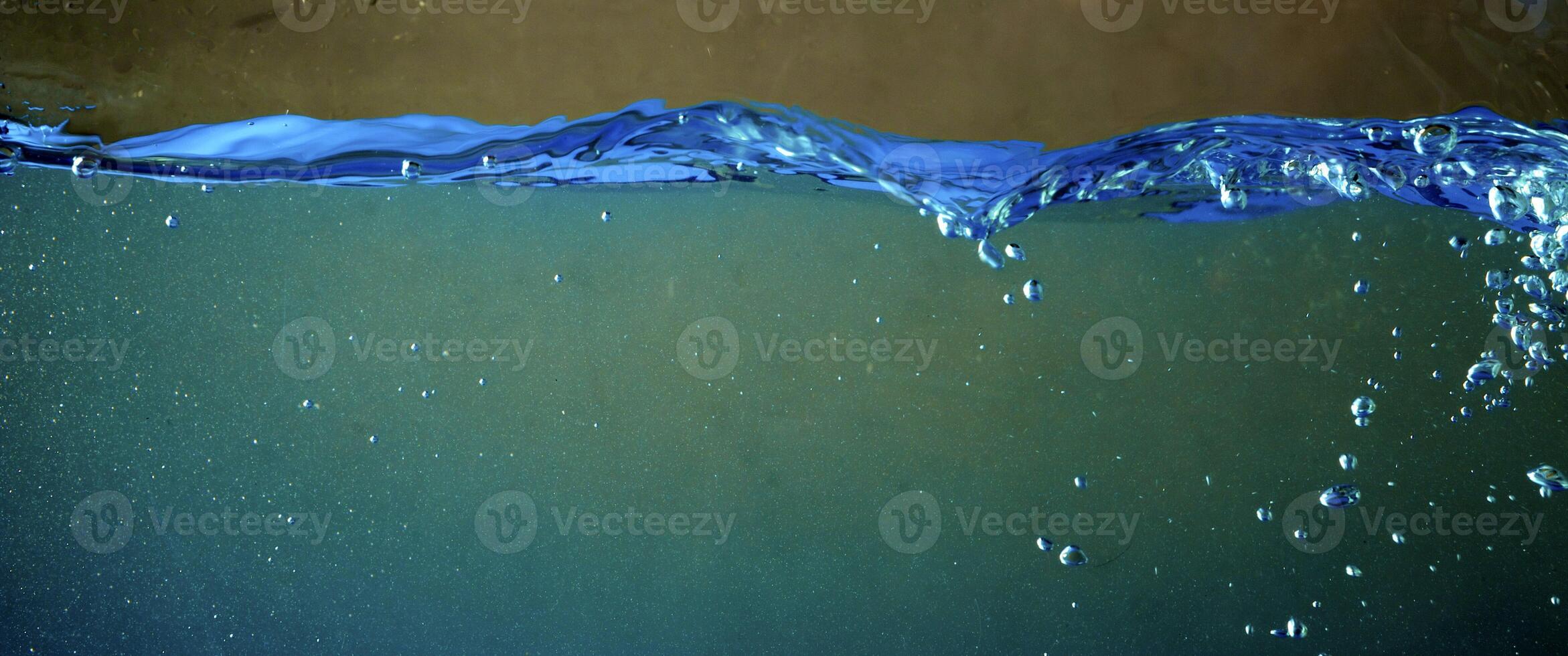 Fresh water with waves and bubbles photo