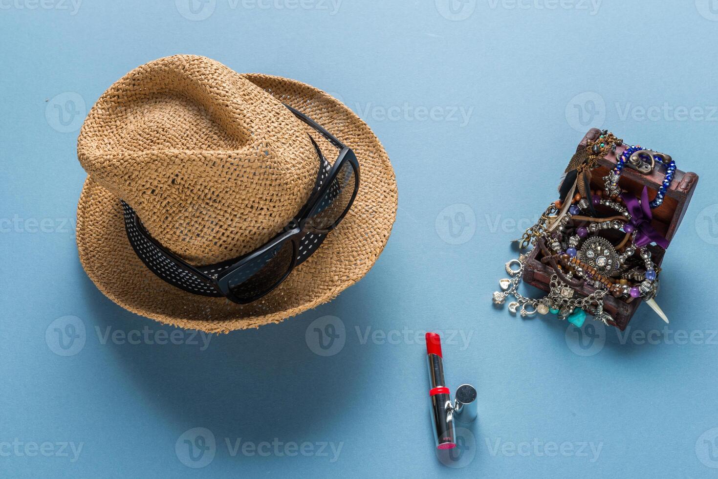 Fashion accessories with hat, sunglasses, necklace photo