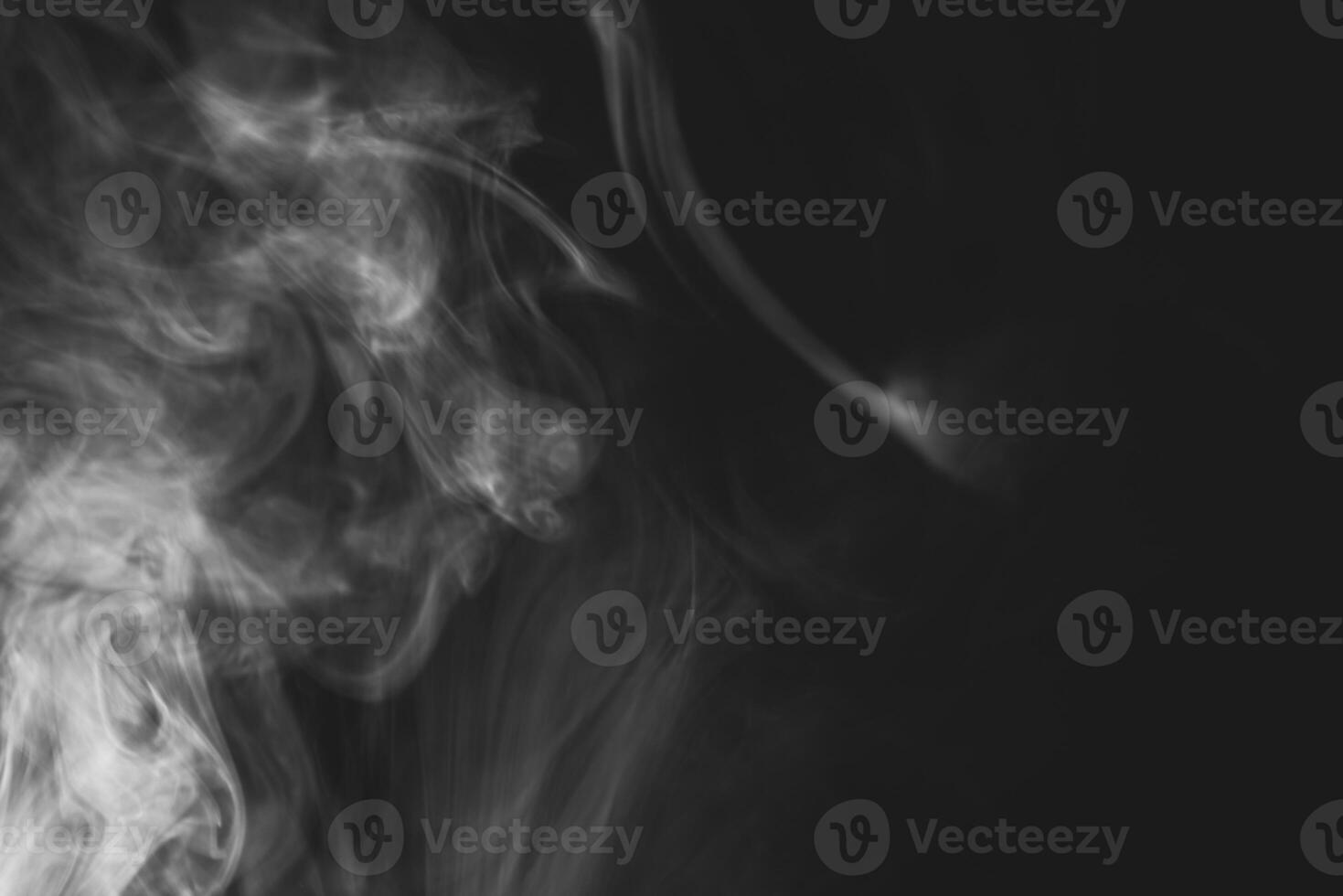 White smoke isolated on black background photo