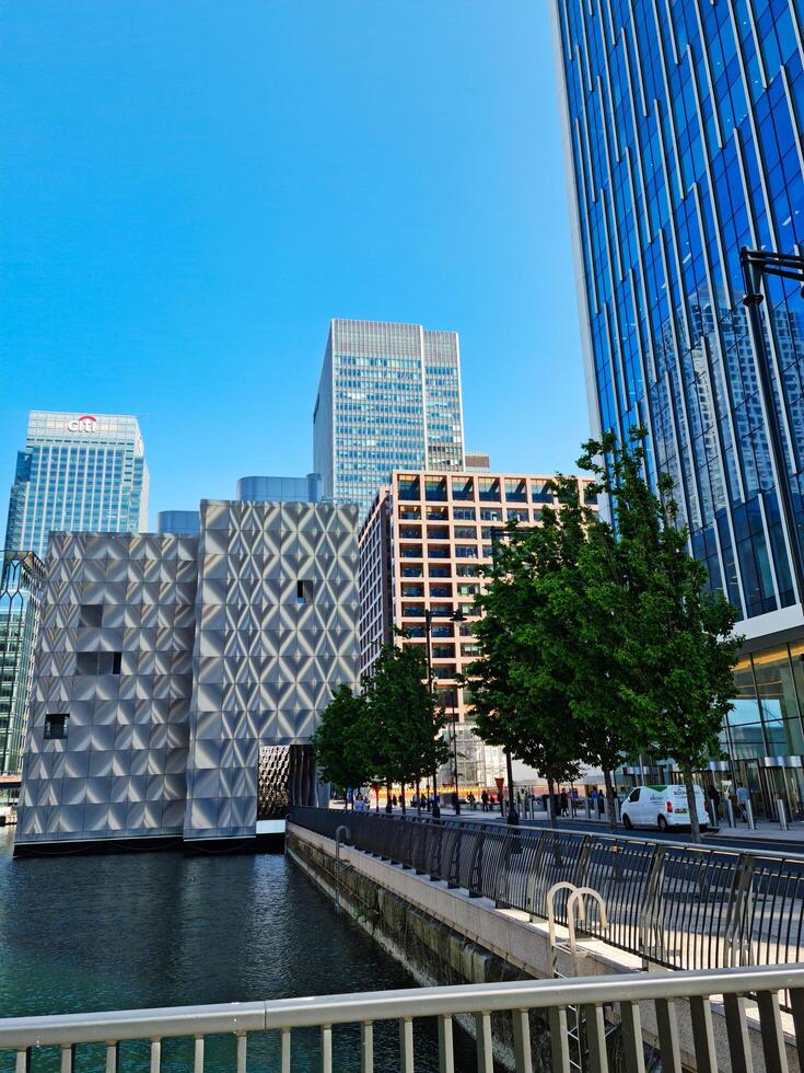 Low Angle View of Canary Wharf Buildings at Central London City of England Great Britain. The Footage Was Captured on 08-June-2023 During Clear Day. photo