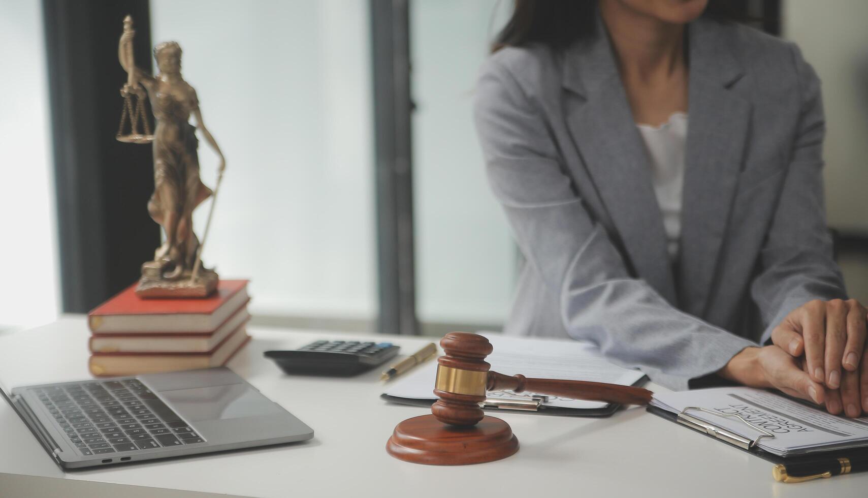 Lawyer, legal advisor, businessman brainstorming information on agreement details Business contracts in legal processing books for accuracy in contract documents. joint financial investment. photo