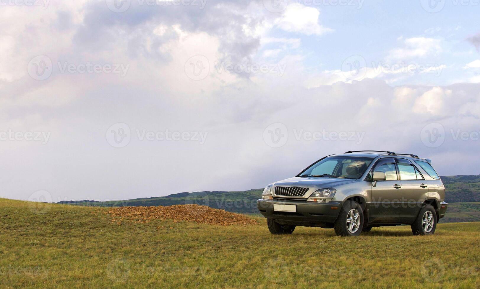 Off-road car highly in mountains photo