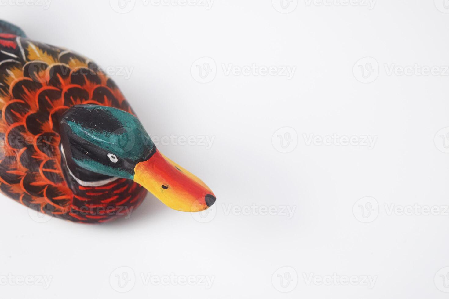 The typical Indonesian toy duck is made of wood and painted colors photo