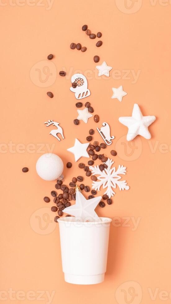 Mockup of coffee cardboard cup with Christmas decorations flat lay, top view on trendy 2024 Peach Fuzz color background photo