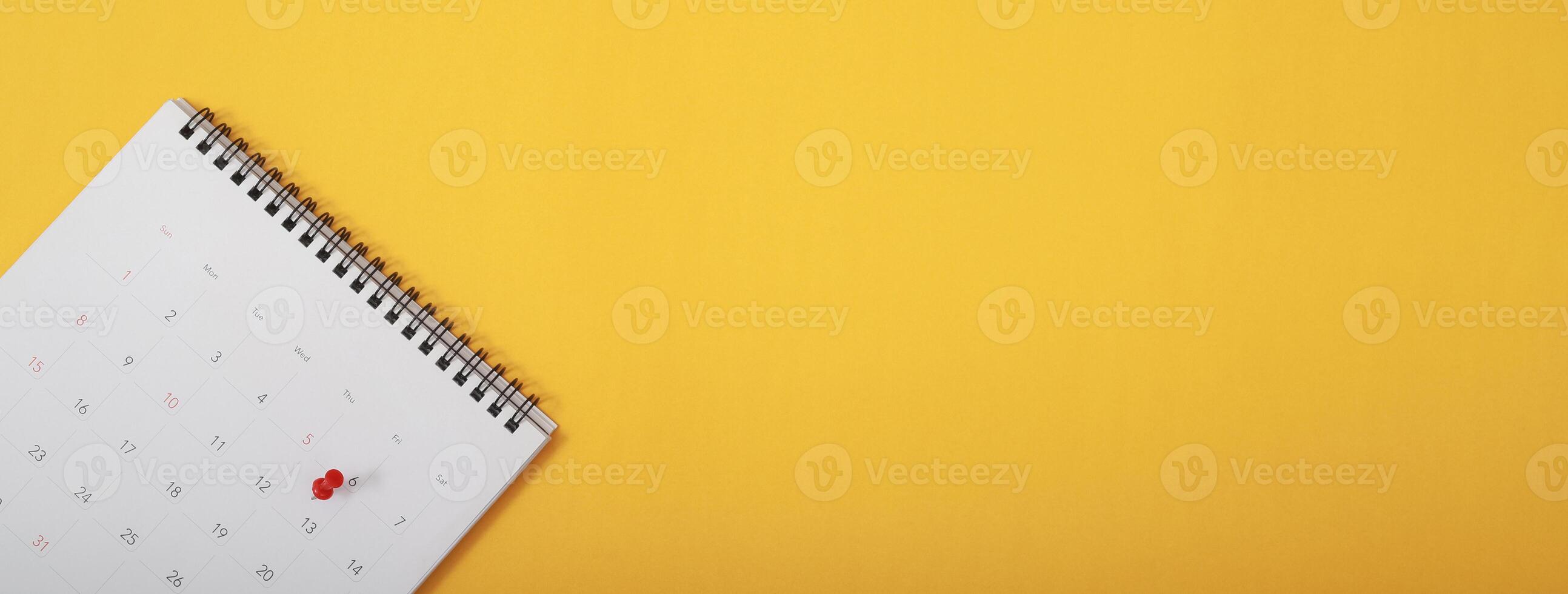 mark the event day with a pin. Thumbtack in calendar concept for busy timeline organize schedule,appointment meeting reminder. planning business meeting or travel holiday planning concept. soft focus photo