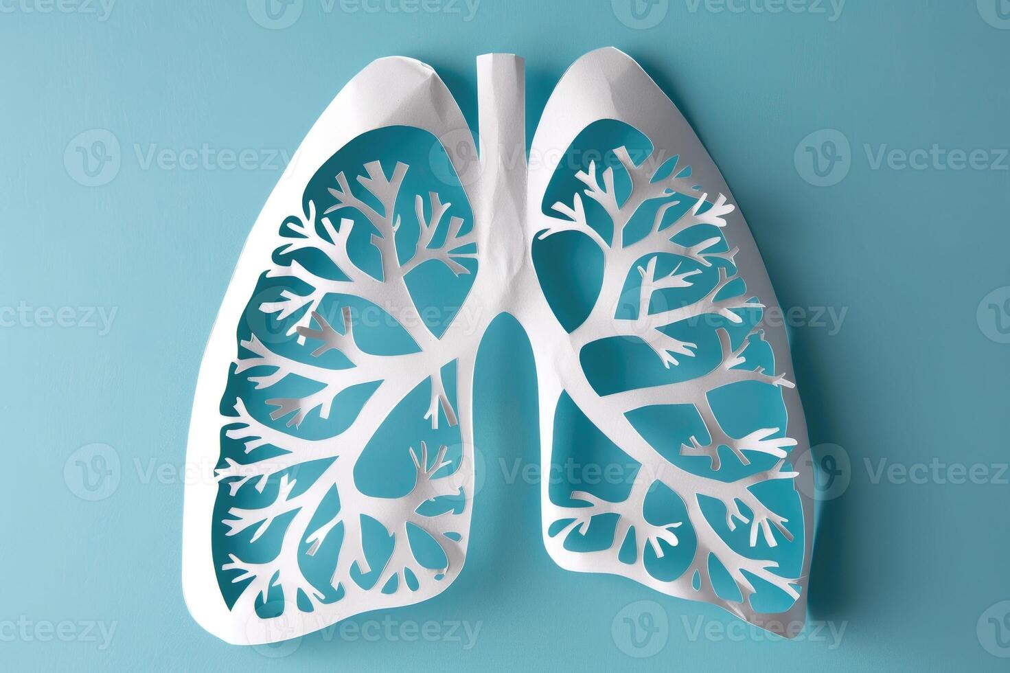 Paper model of human lungs on light blue background. Respiratory health, health diagnostic concept. World no tobacco day. photo
