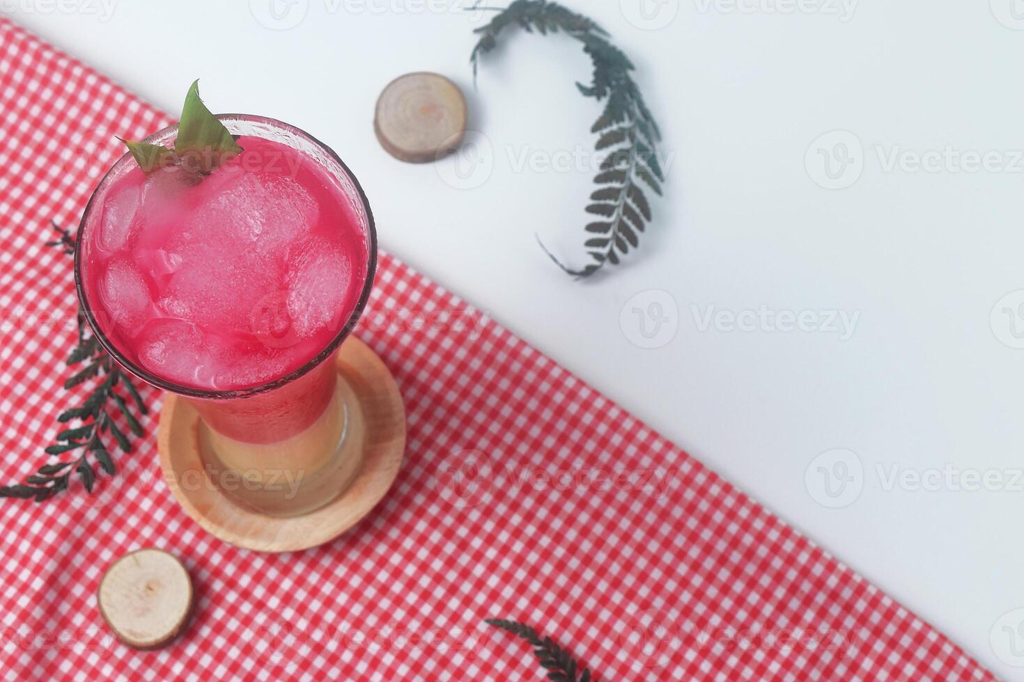 Red soda mixed with milk is a typical Indonesian drink is Soda Gembira photo