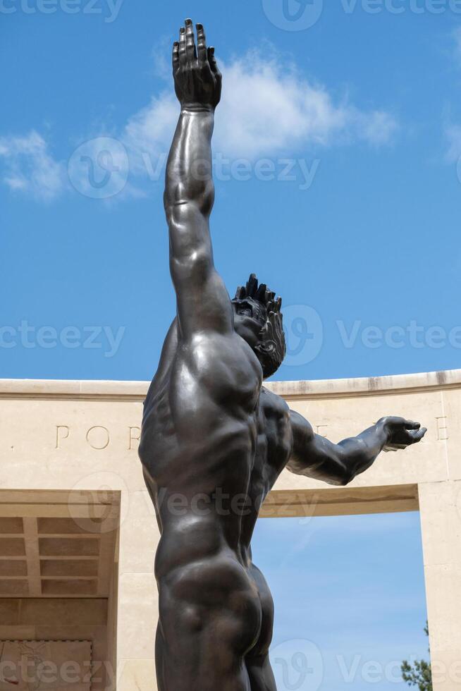 American cemetery statue at Normandy area. Skyward reach. WWII memorial. photo