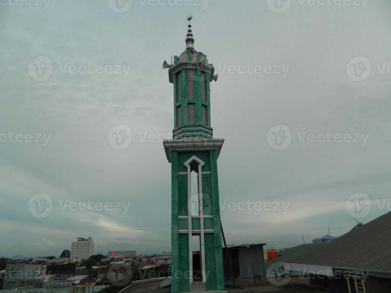 Photo of the mosque tower taken from the top floor of a multi-storey building. The mosque tower is used as a marker and also as a loudspeaker