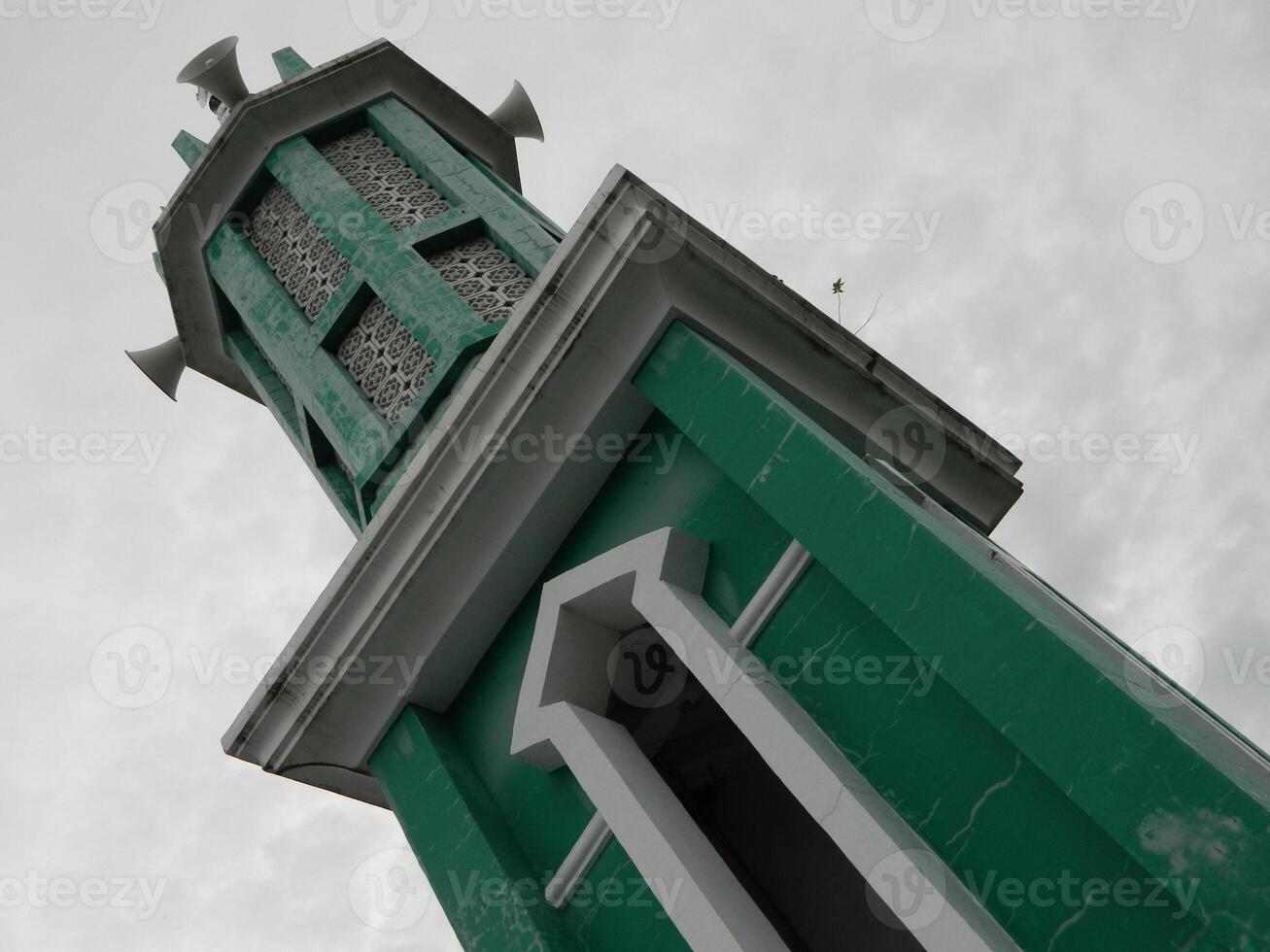 Photo of the mosque tower taken from the top floor of a multi-storey building. The mosque tower is used as a marker and also as a loudspeaker