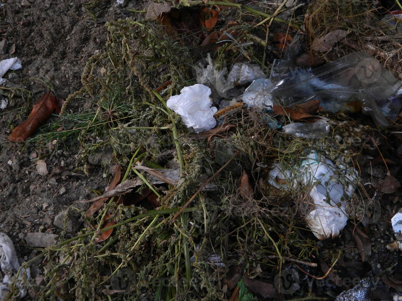 Waste that can damage the environment is often found in urban areas with poor waste management photo