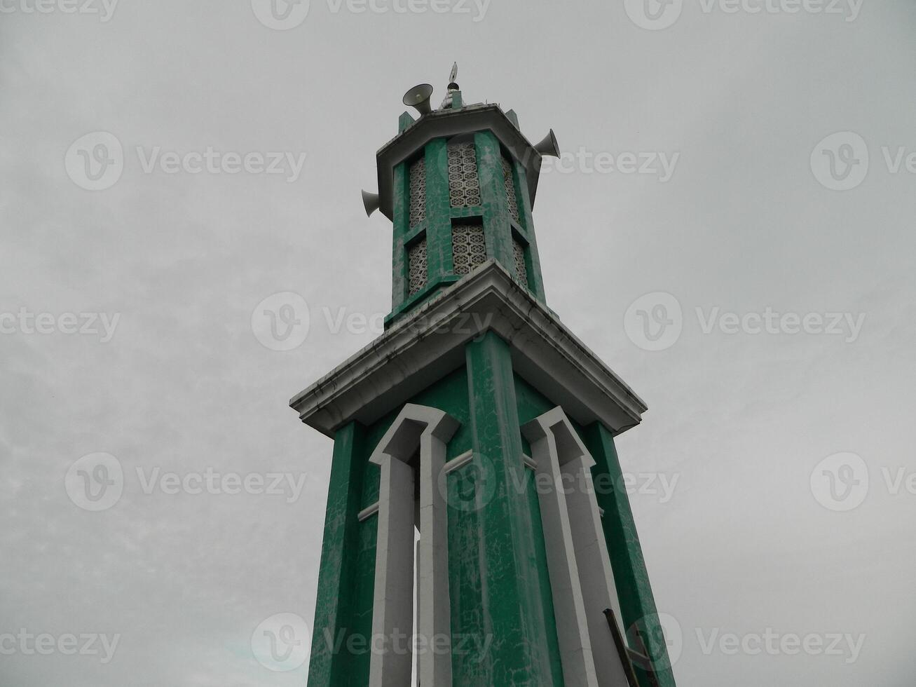 Photo of the mosque tower taken from the top floor of a multi-storey building. The mosque tower is used as a marker and also as a loudspeaker