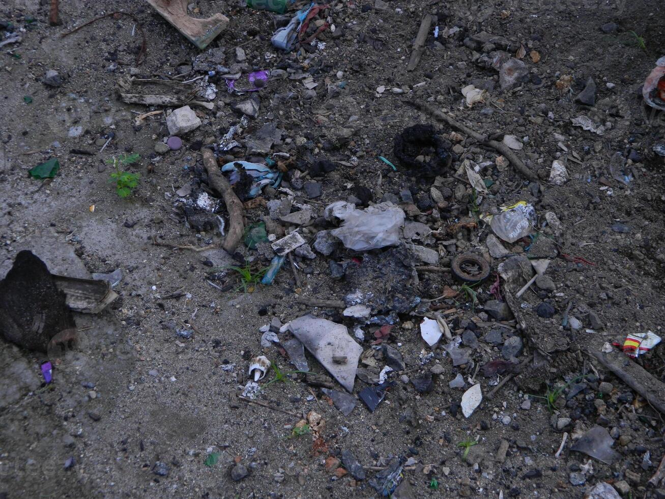 Waste that can damage the environment is often found in urban areas with poor waste management photo