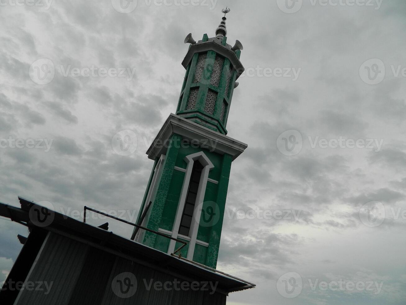 Photo of the mosque tower taken from the top floor of a multi-storey building. The mosque tower is used as a marker and also as a loudspeaker