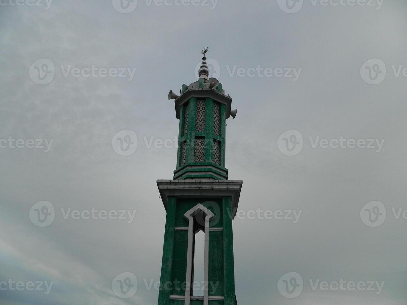 Photo of the mosque tower taken from the top floor of a multi-storey building. The mosque tower is used as a marker and also as a loudspeaker
