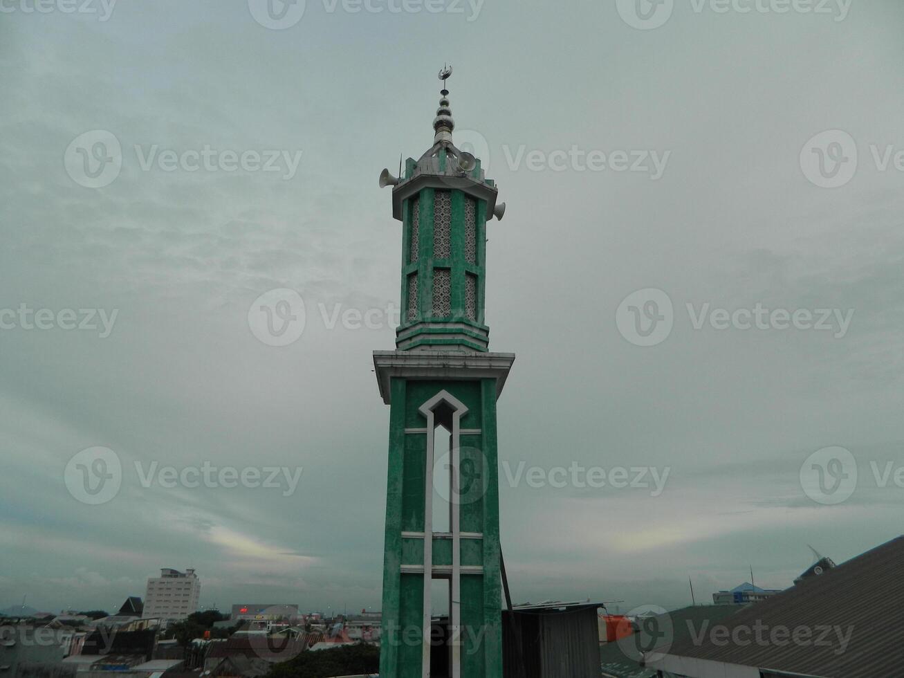 Photo of the mosque tower taken from the top floor of a multi-storey building. The mosque tower is used as a marker and also as a loudspeaker