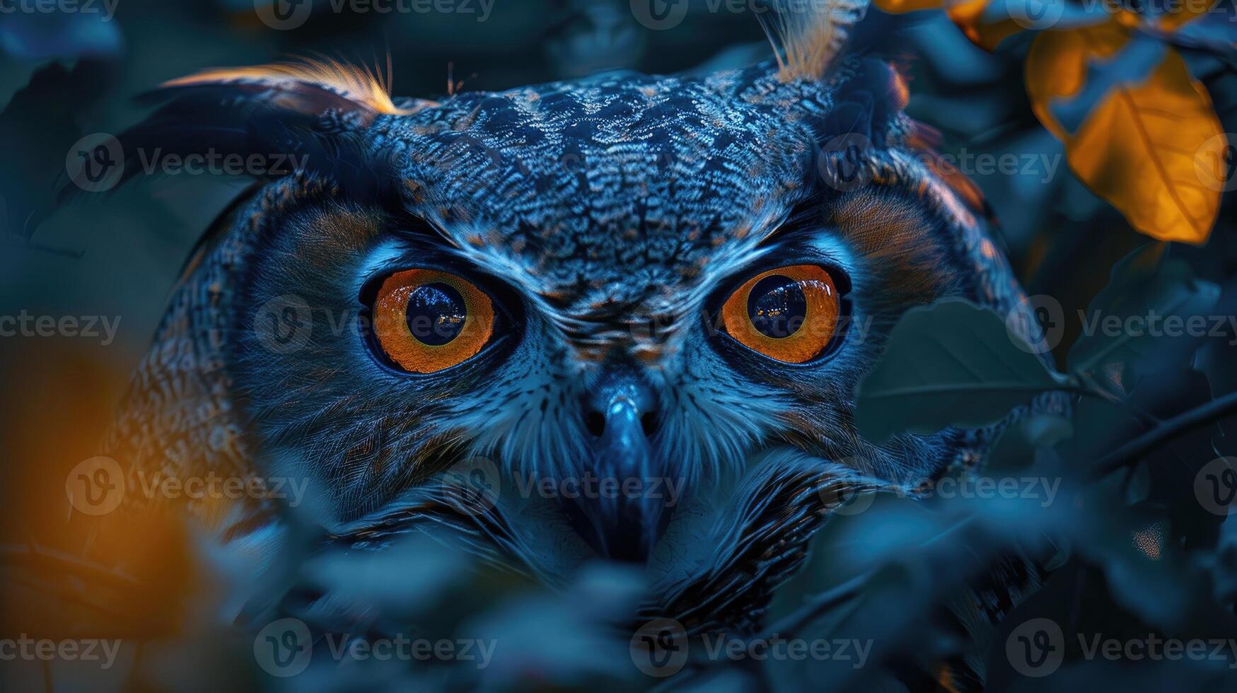 A mysterious owl camouflaged among the leaves, its intense orange eyes piercing through the foliage photo