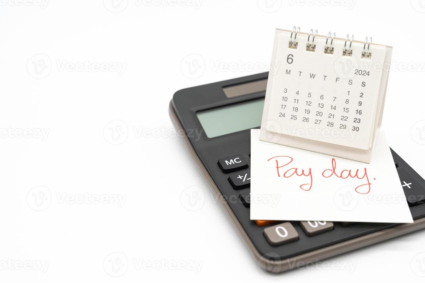 Hand writing text PAY DAY on June 2024 calendar with calculator in isolated background. Reminder concept of payment. copy space. photo