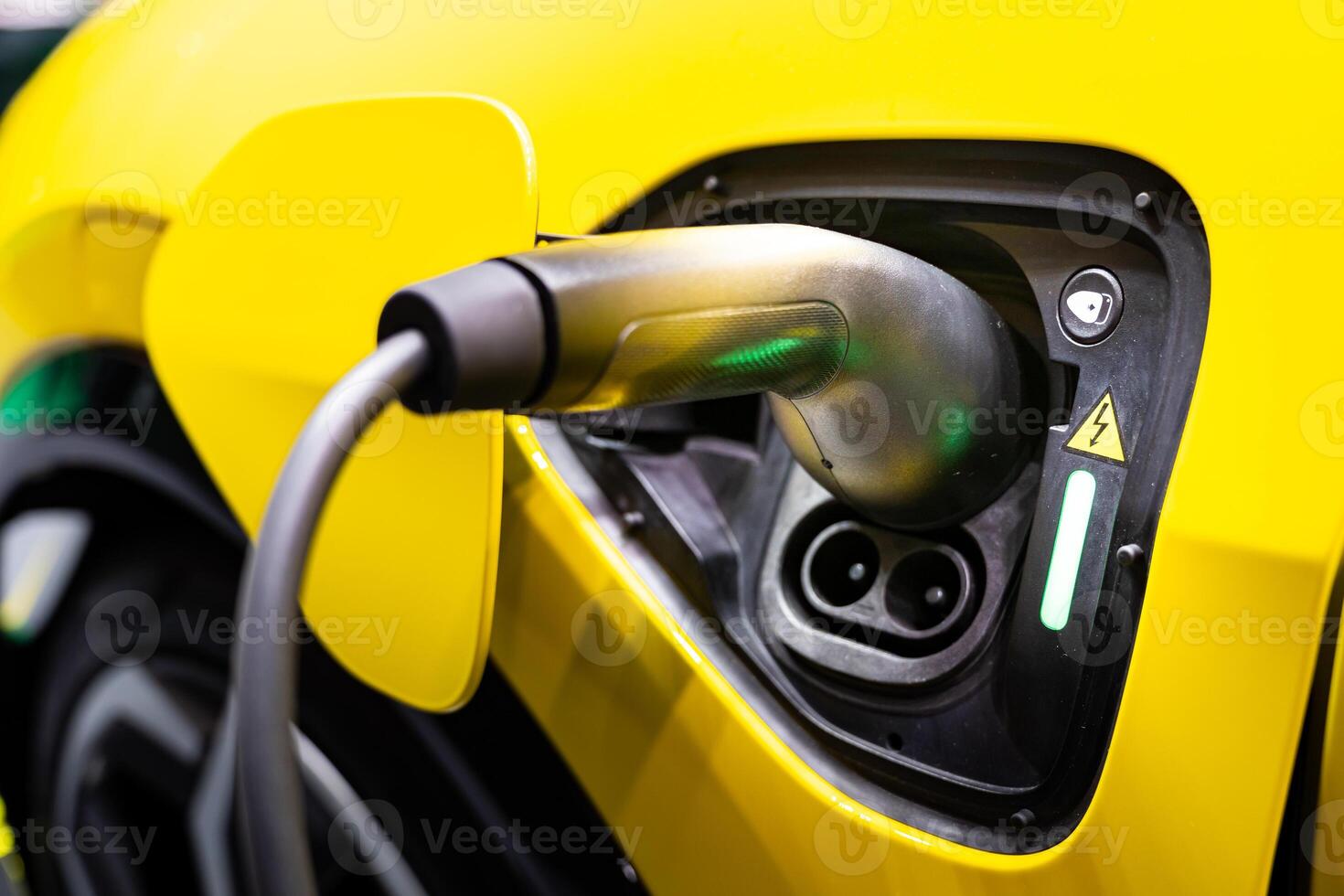 EV Car or Electric car at charging station with the power cable supply plugged. EV charging station for electric car in concept of green energy and eco power produced. photo