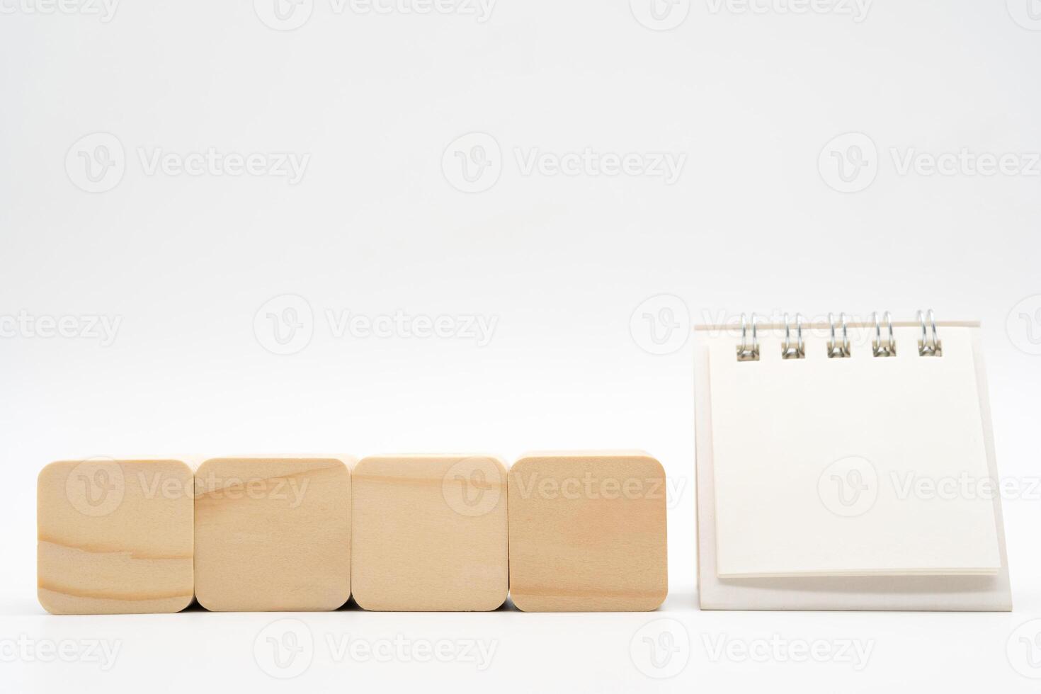 Mockup blank calendar for text with wooden cube shape. Planing concept. Start new year with goal plan. action plan, strategy. photo