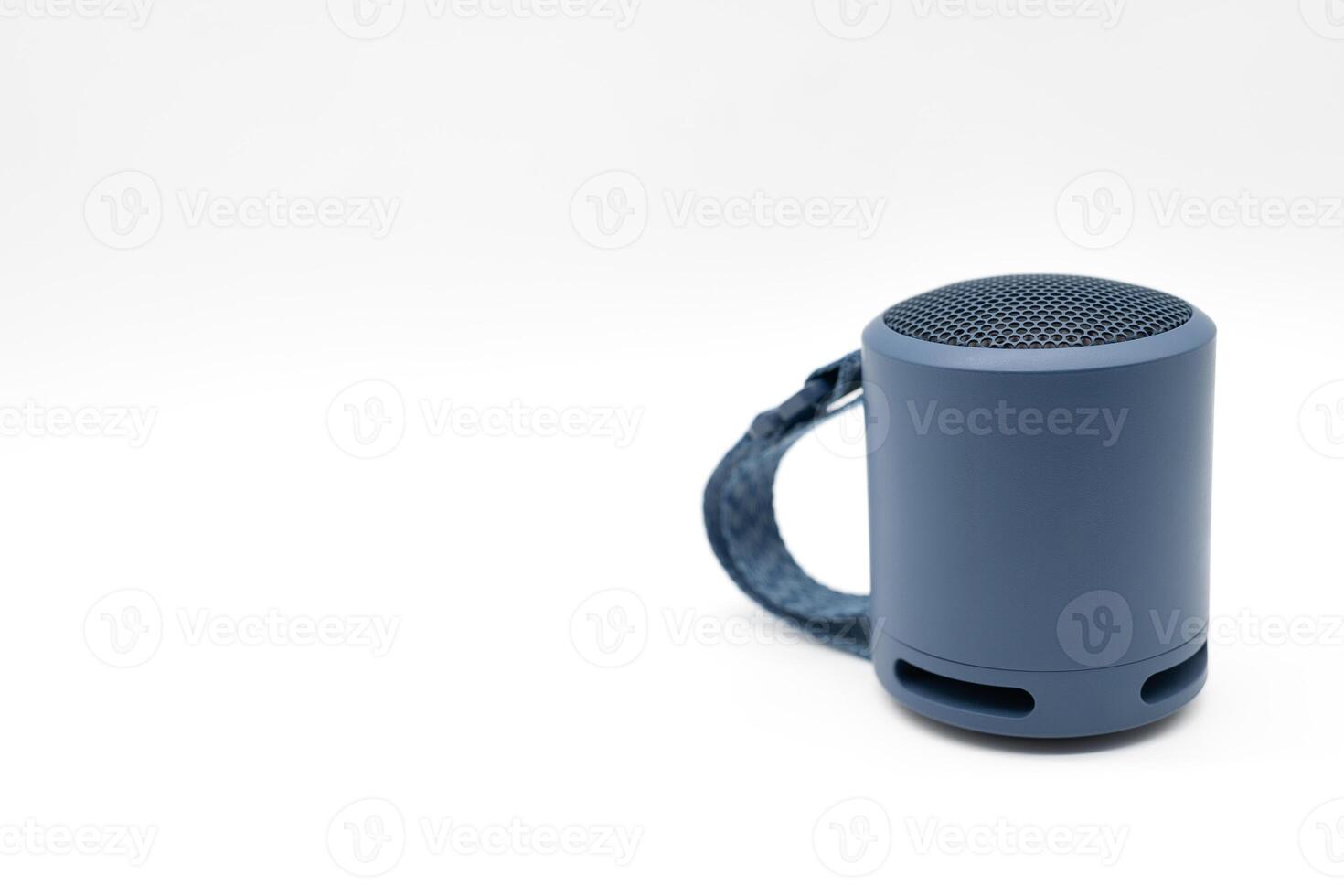 Portable wireless blue speaker isolated on white background. photo