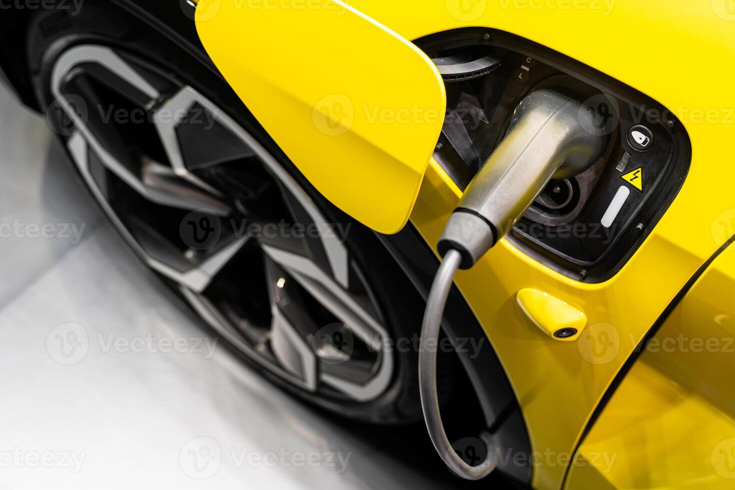 EV Car or Electric car at charging station with the power cable supply plugged. EV charging station for electric car in concept of green energy and eco power produced. photo