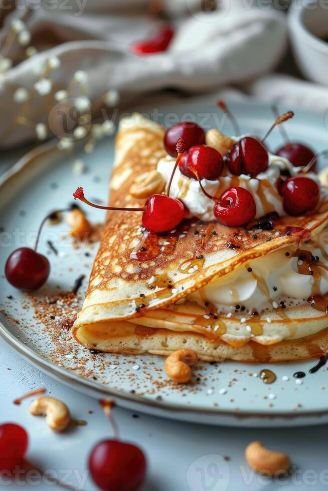 Stack of pancakes topped with cherries photo