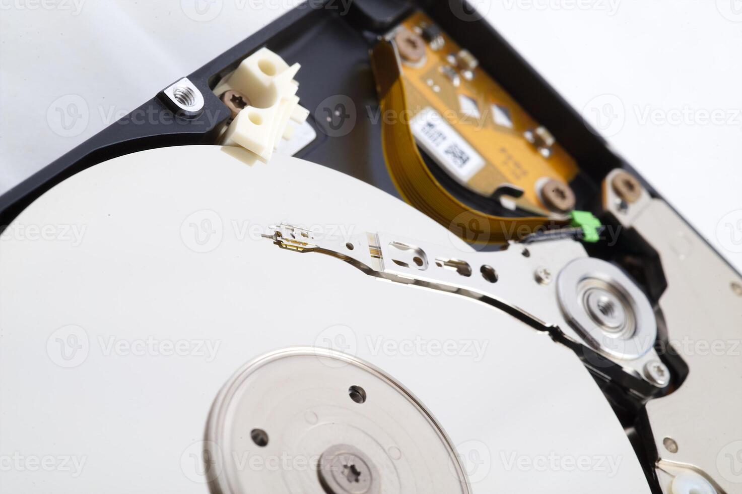 Close-up inside view of hard disk isolated on white background photo