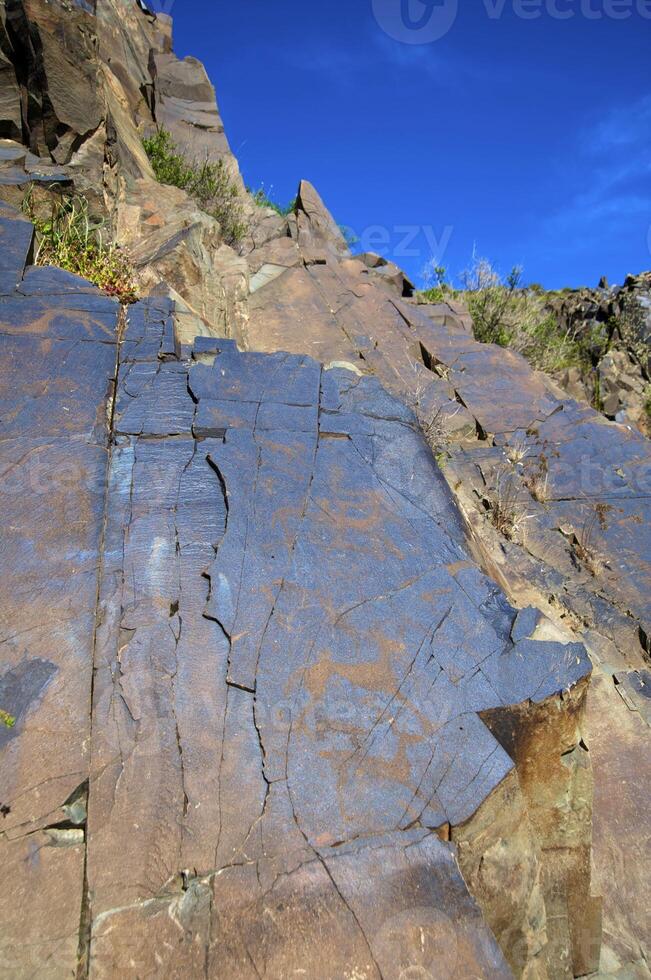 Petroglyphs within the Archaeological Landscape of Tamgaly. Almaty area, Kazakhstan photo