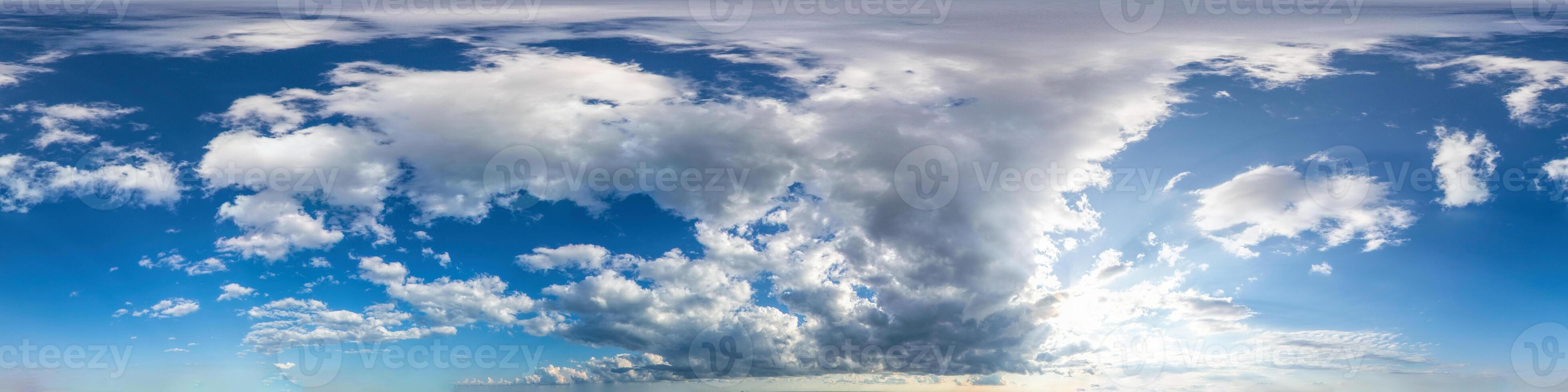 Seamless panorama of sky with puffy Cumulus clouds in spherical equirectangular format with complete zenith for use in 3D graphics, game and composites in aerial drone 360 degree panoramas as sky dome photo