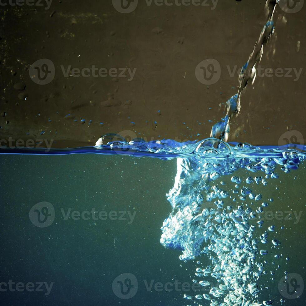 Fresh water with waves and bubbles photo
