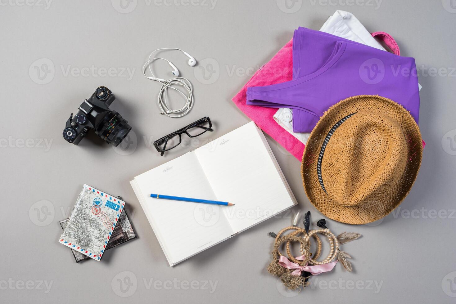 Mock up of summer traveling stuff on grey background. photo