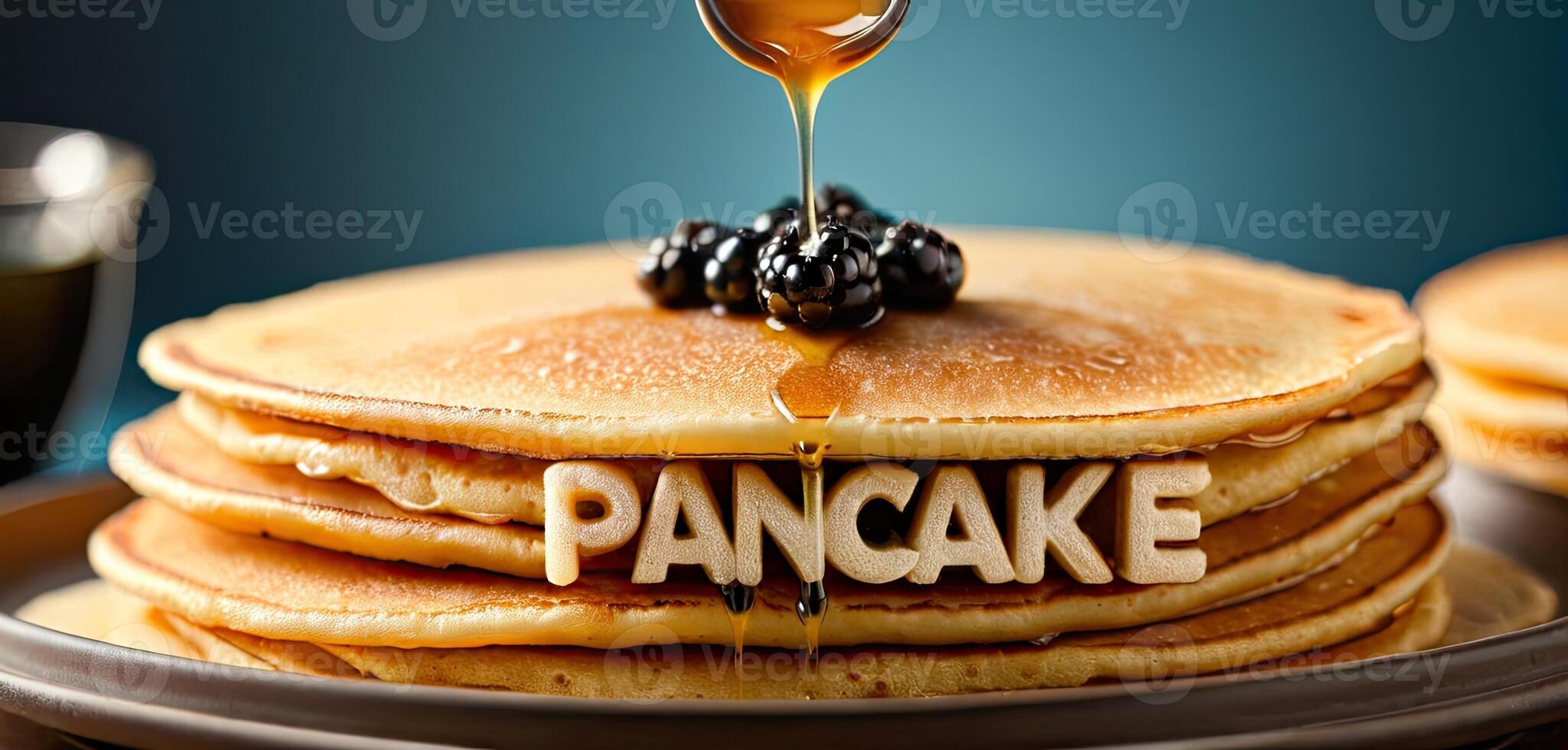 Pancakes, butter, syrup. Stack of golden pancakes on plate, melting butter on top, syrup pouring over, steam rising. cream letters spelling PANCAKES photo