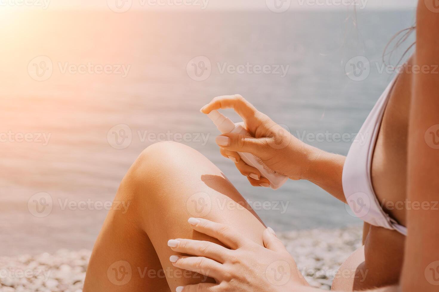 Woman sunscreen sea. Happy lady applies sunblock cream on tanned skin before sunbathing. Female On Sea Vacation Holiday Resort. Woman Use Suncare Lotion On Beach, Applying Sunscreen Lotion On Body photo