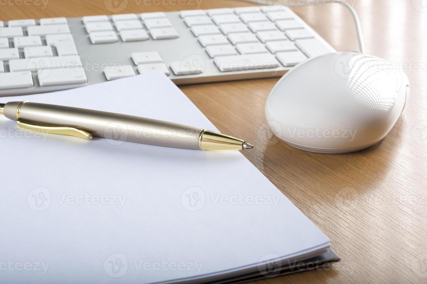Modern aluminum computer keyboards, mouse and notebook photo